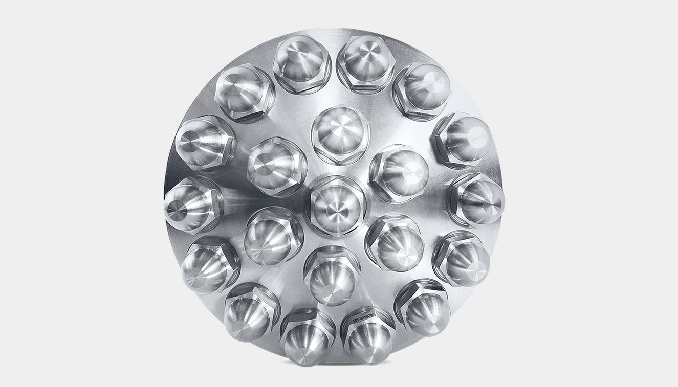 Frontal view: SCHLICK nozzle head with 21 hollow-cone nozzles arranged in a circle.
