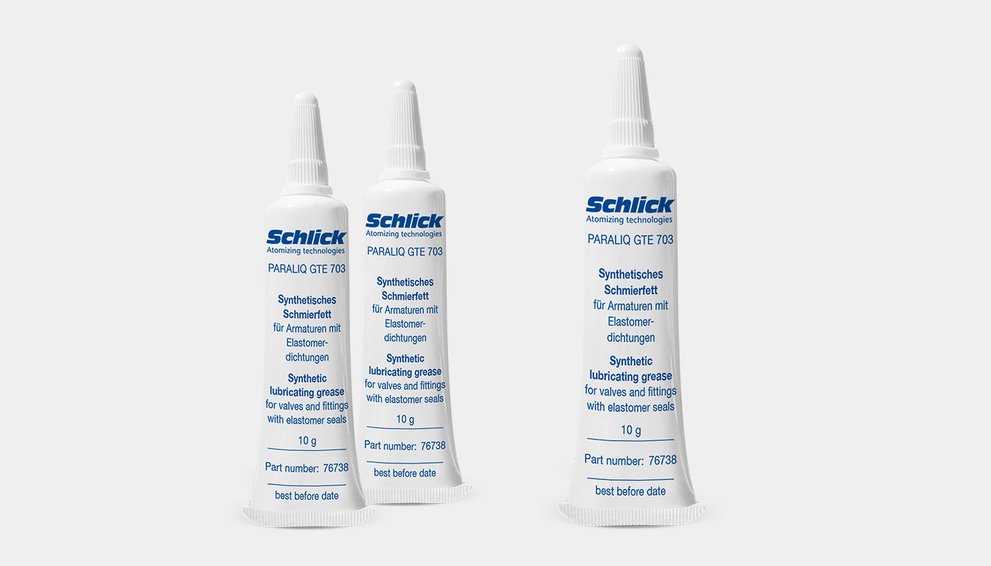 Standing upright: three tubes of SCHLICK synthetic lubricating grease (PARALIC GTE 703).