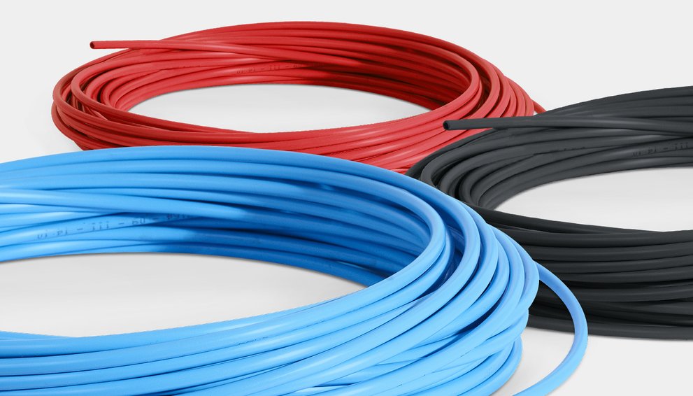 Rolled PE hose material in three versions: blue for liquid, red for control air and black for atomising air.