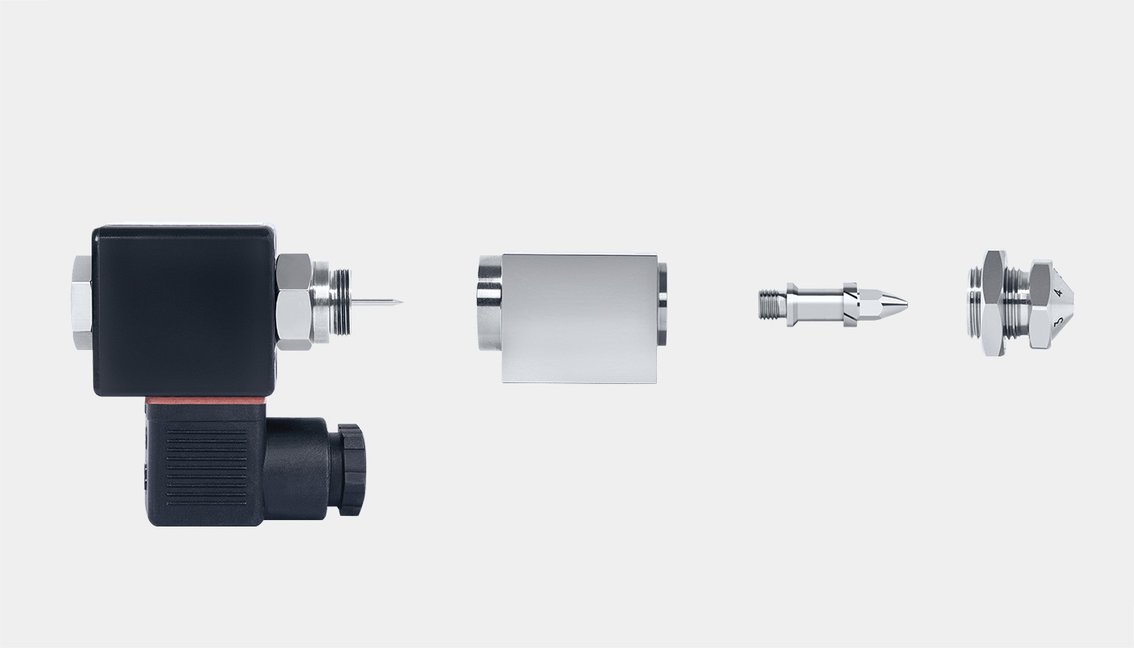 Side view of SCHLICK Model 970 Form 8 in 4 individual parts: solenoid valve, nozzle body, liquid insert and air cap.