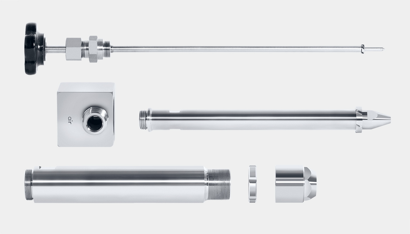 Side view of SCHLICK Model 0/4 Form 4 in 6 individual parts: Liquid flow control needle, nozzle body, liquid insert with pipe, air pipe, check nut and air cap